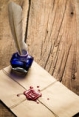 blue-ink-inkwell-feather-envelope-red-sealant-old-wooden-table-30678218